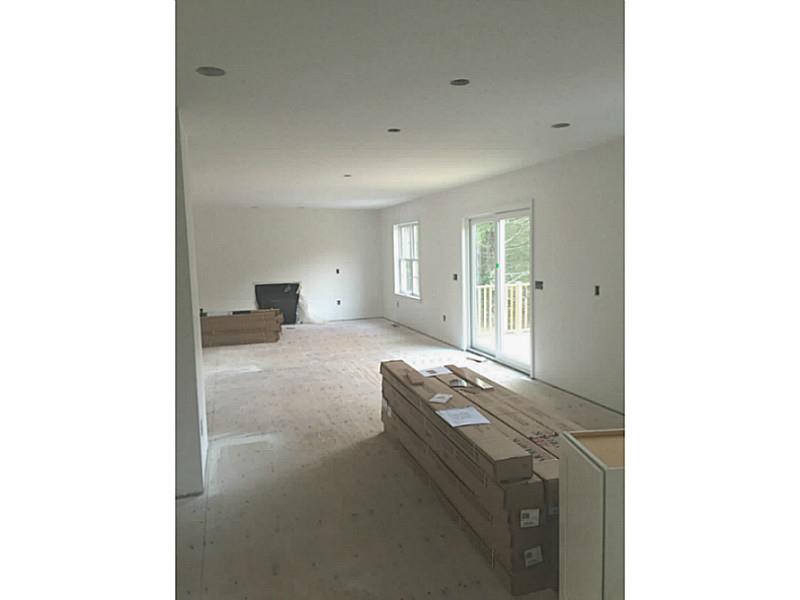 14 Shady Grove Road Hopkinton, RI 02832 - Photo 8 of 23 Kitchen. From back of kitchen looking into family room with fireplace