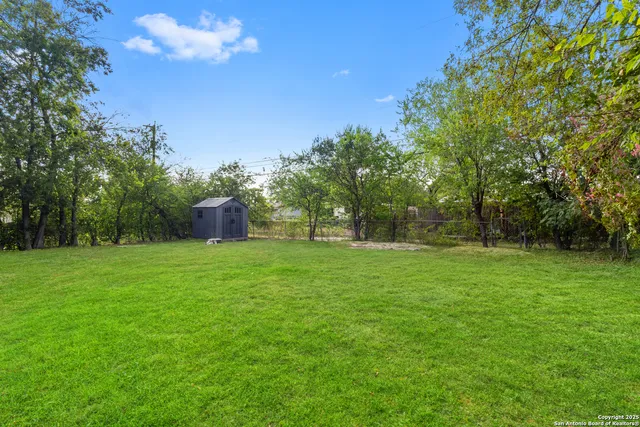 a backyard of a house with lots of green space