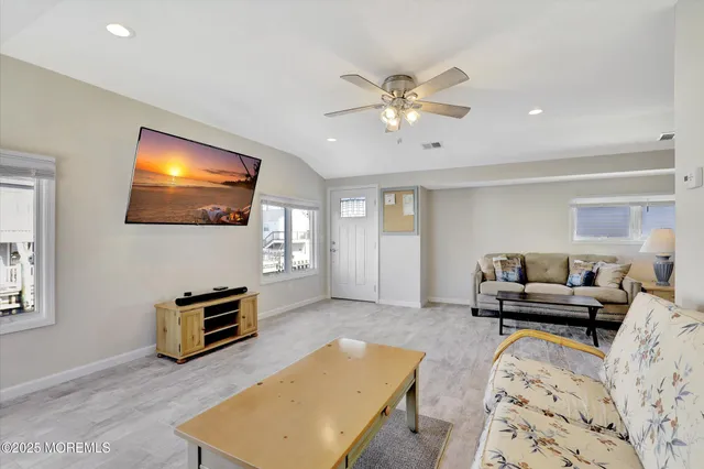 a living room with furniture and a table
