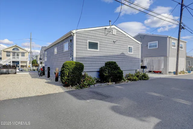 a sitting area with furniture and wooden floor