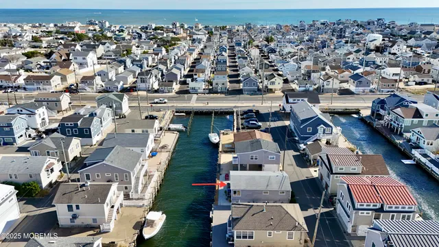an aerial view of a house with a ocean view
