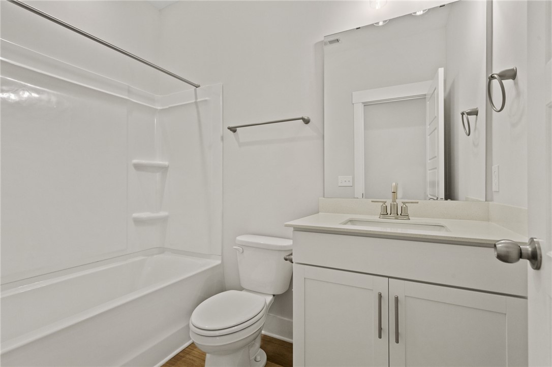315 Old Shirley Road Central, SC 29630 - Photo 6 of 26 This bright bathroom features a vanity with ample storage, a shower-tub combination, and clean, contemporary finishes.