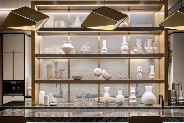 a living room with furniture and floor to ceiling window