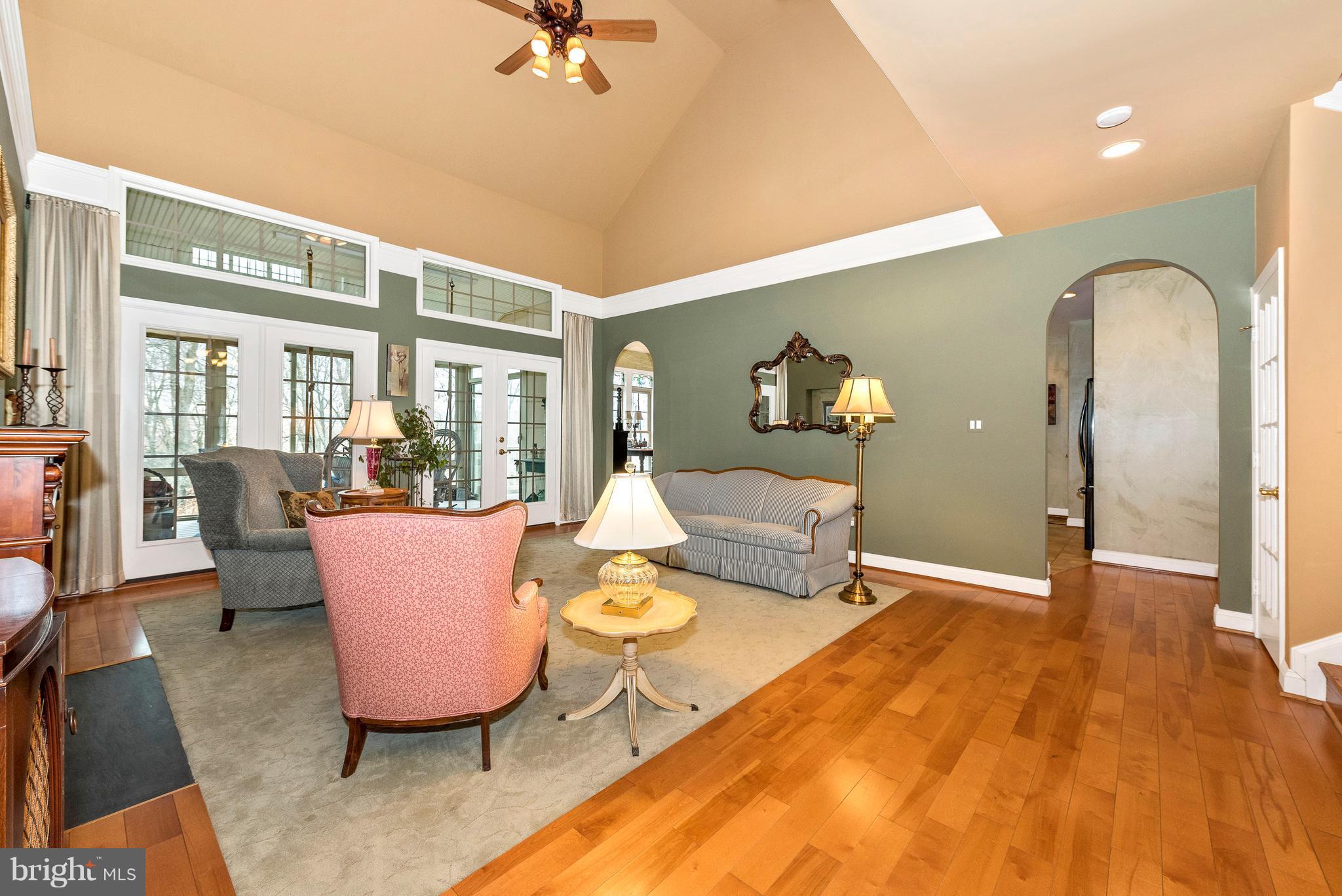 Spacious Formal Living Room Leading to Sunroom