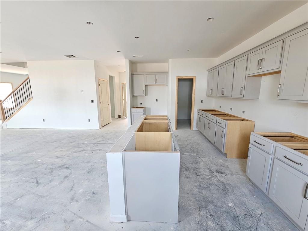 30 Silverleaf Trail Bethlehem, GA 30620 - Photo 13 of 55 a large white kitchen with cabinets