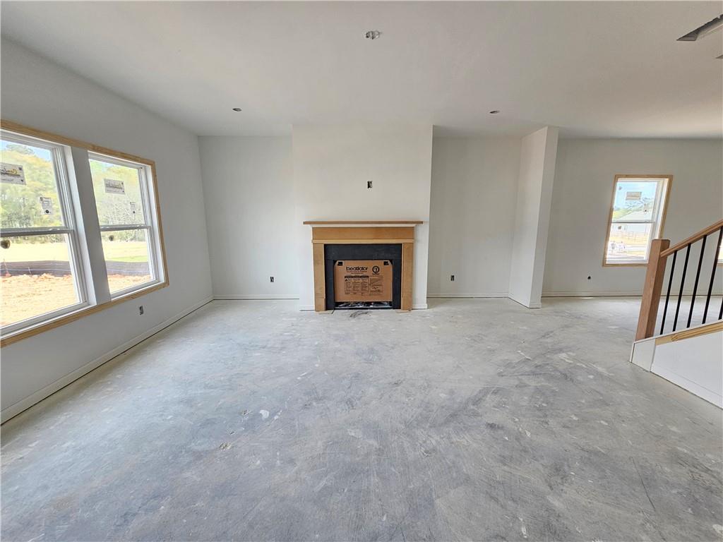 30 Silverleaf Trail Bethlehem, GA 30620 - Photo 15 of 55 a view of an empty room with a fireplace and a window