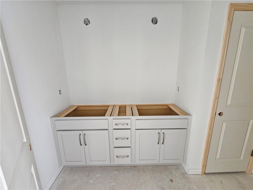 30 Silverleaf Trail Bethlehem, GA 30620 - Photo 30 of 55 a utility room with cabinets