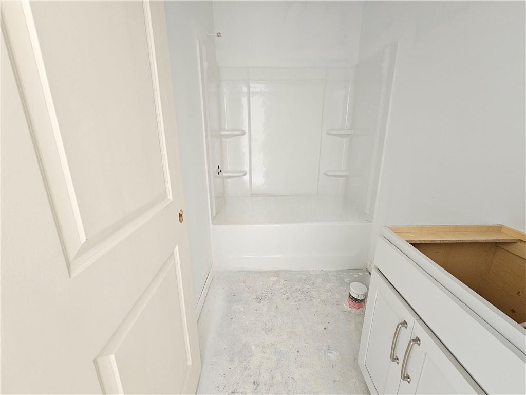 30 Silverleaf Trail Bethlehem, GA 30620 - Photo 4 of 55 a bathroom with a tub sink and vanity