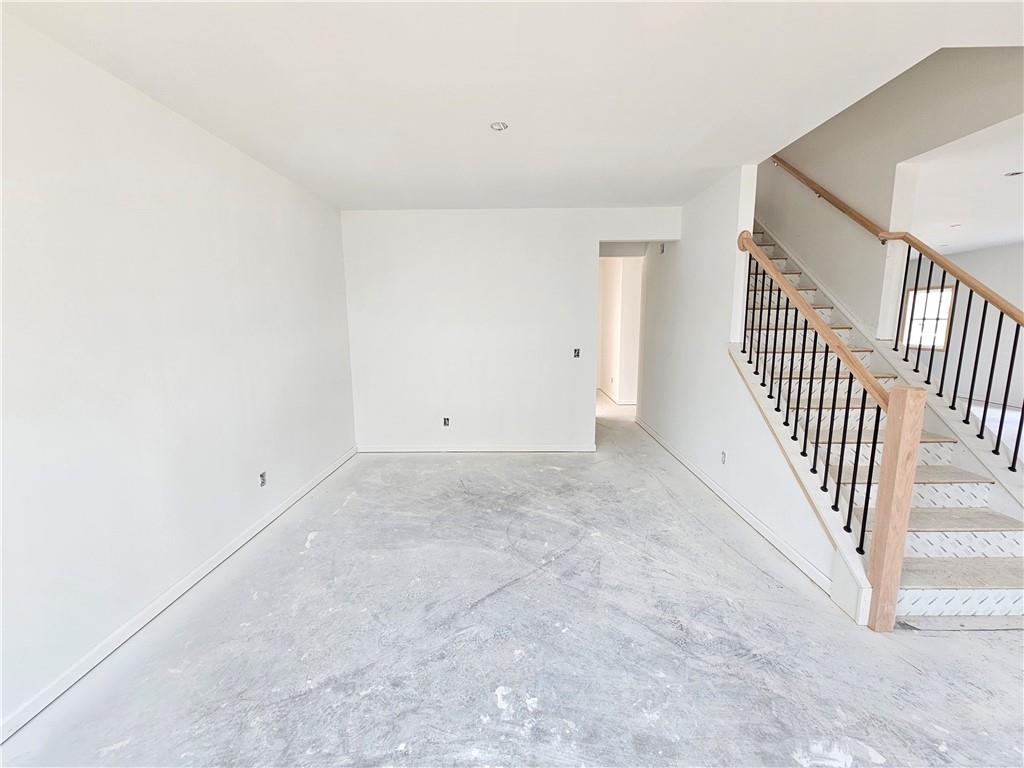 30 Silverleaf Trail Bethlehem, GA 30620 - Photo 7 of 55 an empty room with staircase and white walls