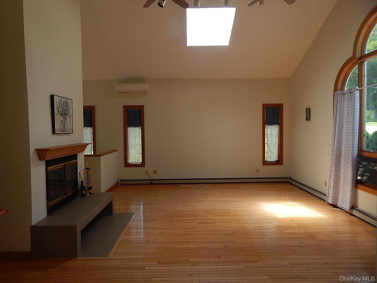 16 Kenton Road Patterson, NY 12563 - Photo 3 of 20 a view of an empty room with window and fire place