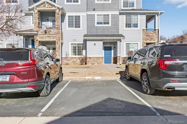 a view of a car in front of a house