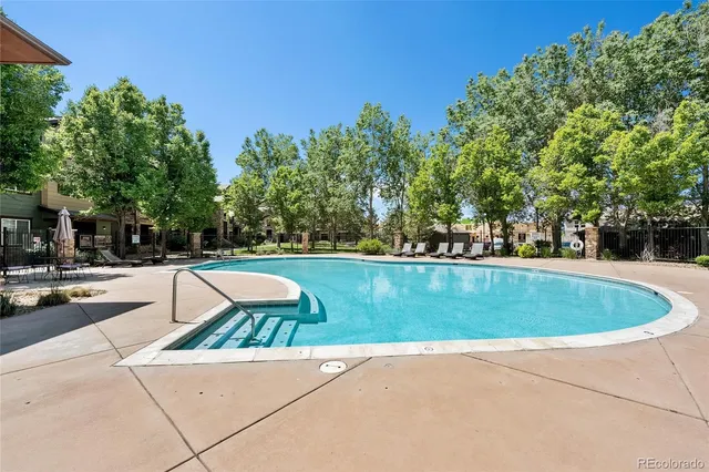 a view of outdoor space yard swimming pool and green space