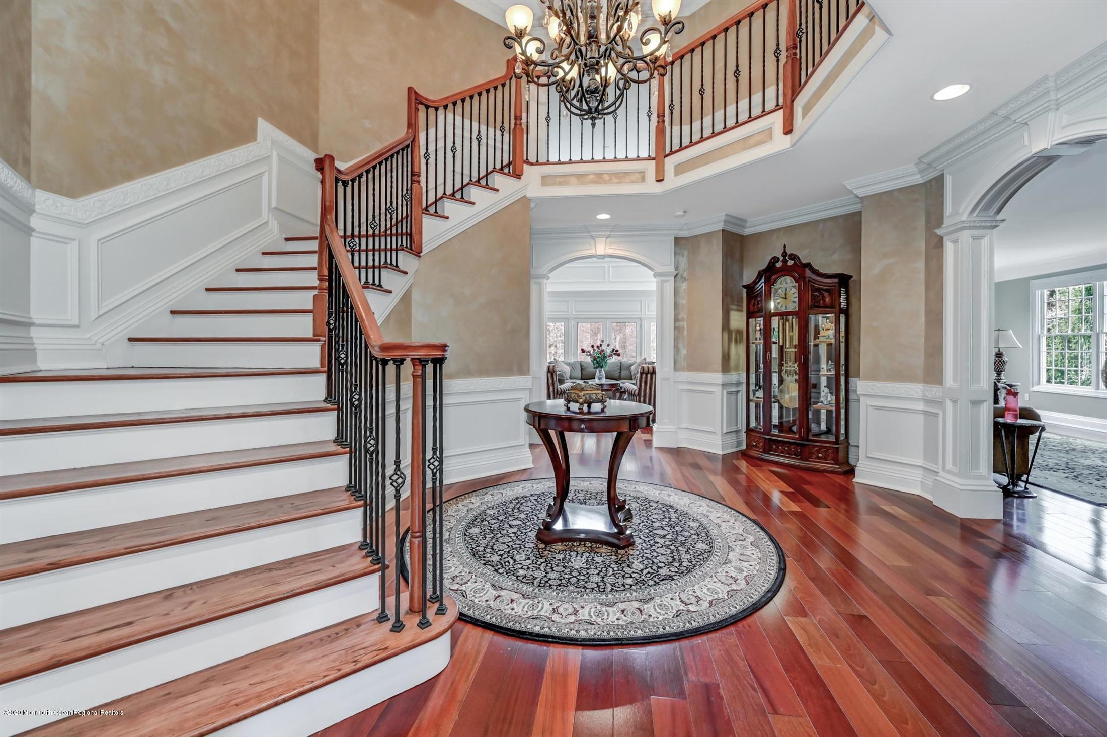 8 Maple Leaf Drive Holmdel, NJ 07733 - Photo 17 of 74 a view of a livingroom with furniture a chandelier and wooden floor