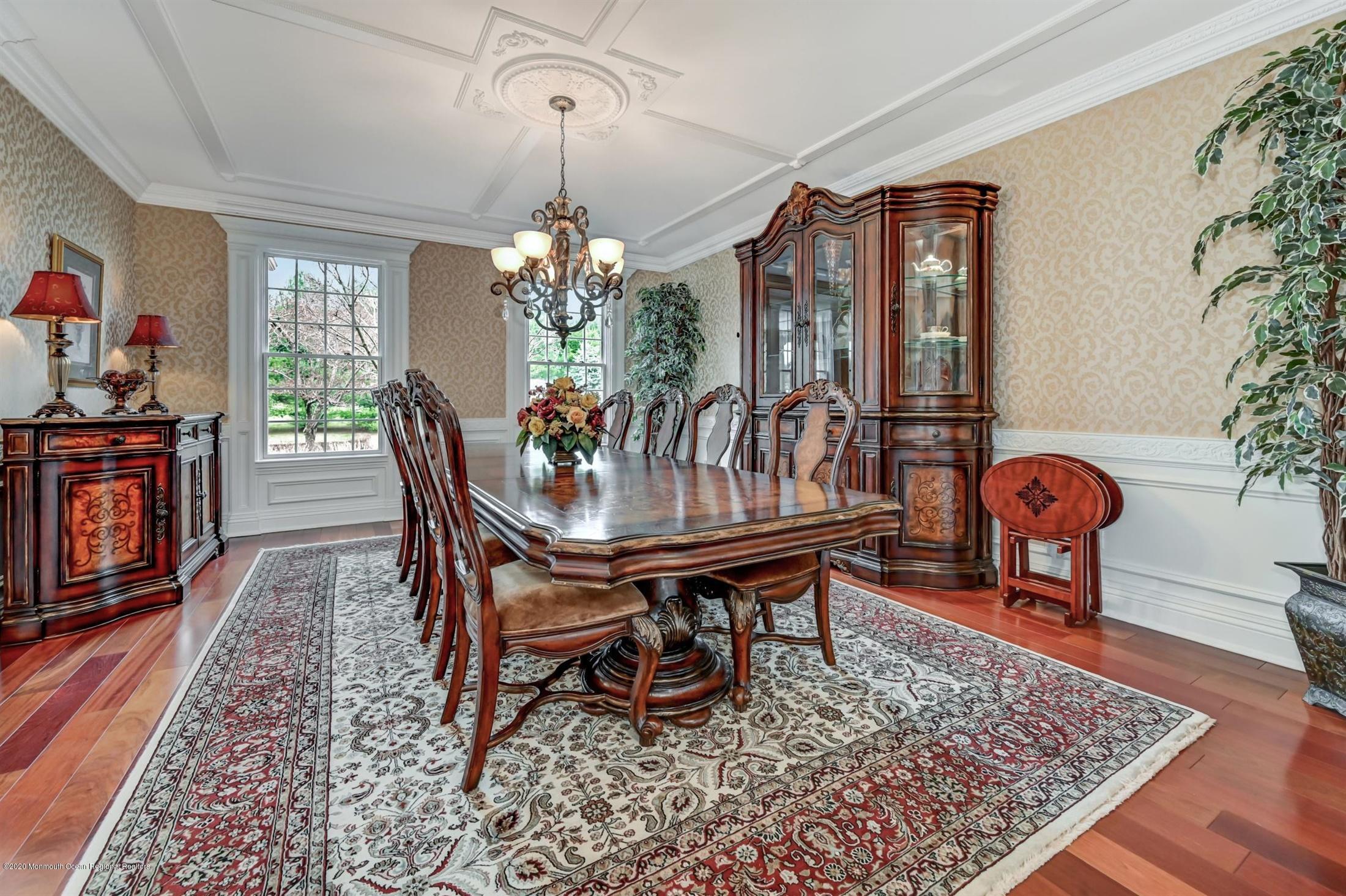 8 Maple Leaf Drive Holmdel, NJ 07733 - Photo 20 of 74 a dining room with furniture chandelier and wooden floor