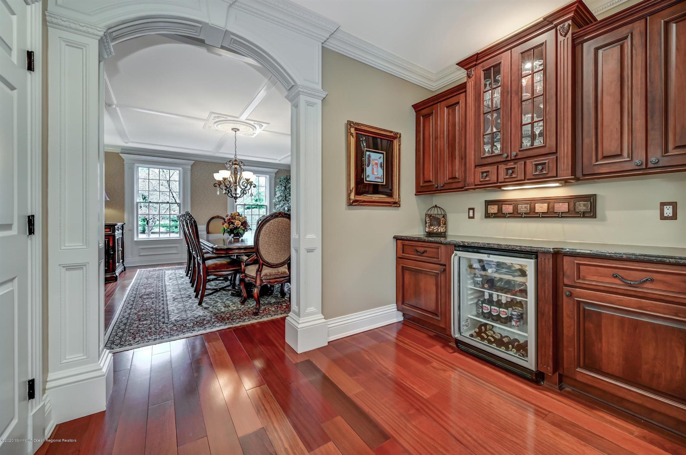 8 Maple Leaf Drive Holmdel, NJ 07733 - Photo 21 of 74 a view of a kitchen with furniture hardwood floor and a ceiling fan