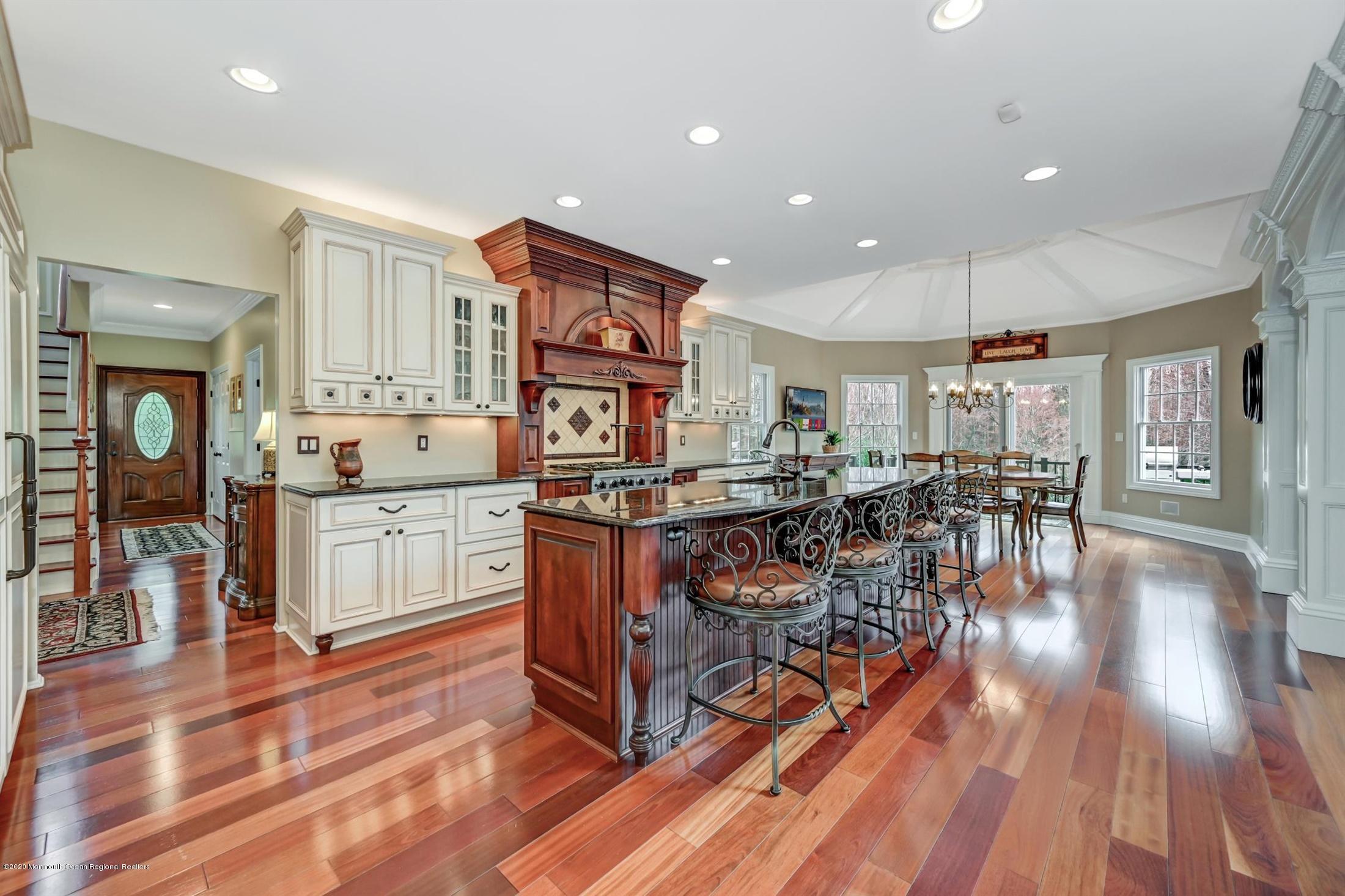 8 Maple Leaf Drive Holmdel, NJ 07733 - Photo 22 of 74 a living room with lots of wooden furniture and white walls