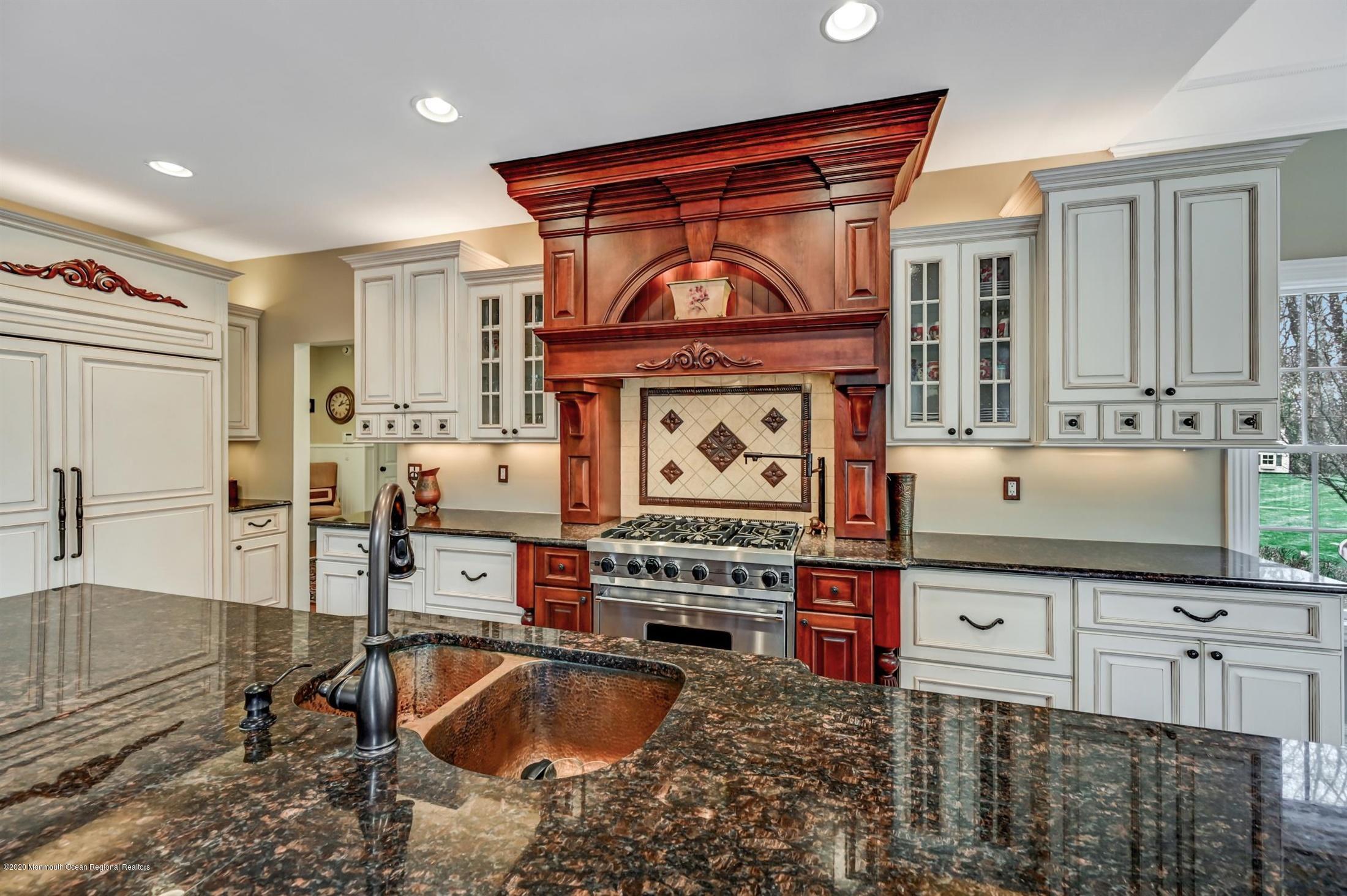 8 Maple Leaf Drive Holmdel, NJ 07733 - Photo 23 of 74 a kitchen with stainless steel appliances kitchen island granite countertop a stove and a sink