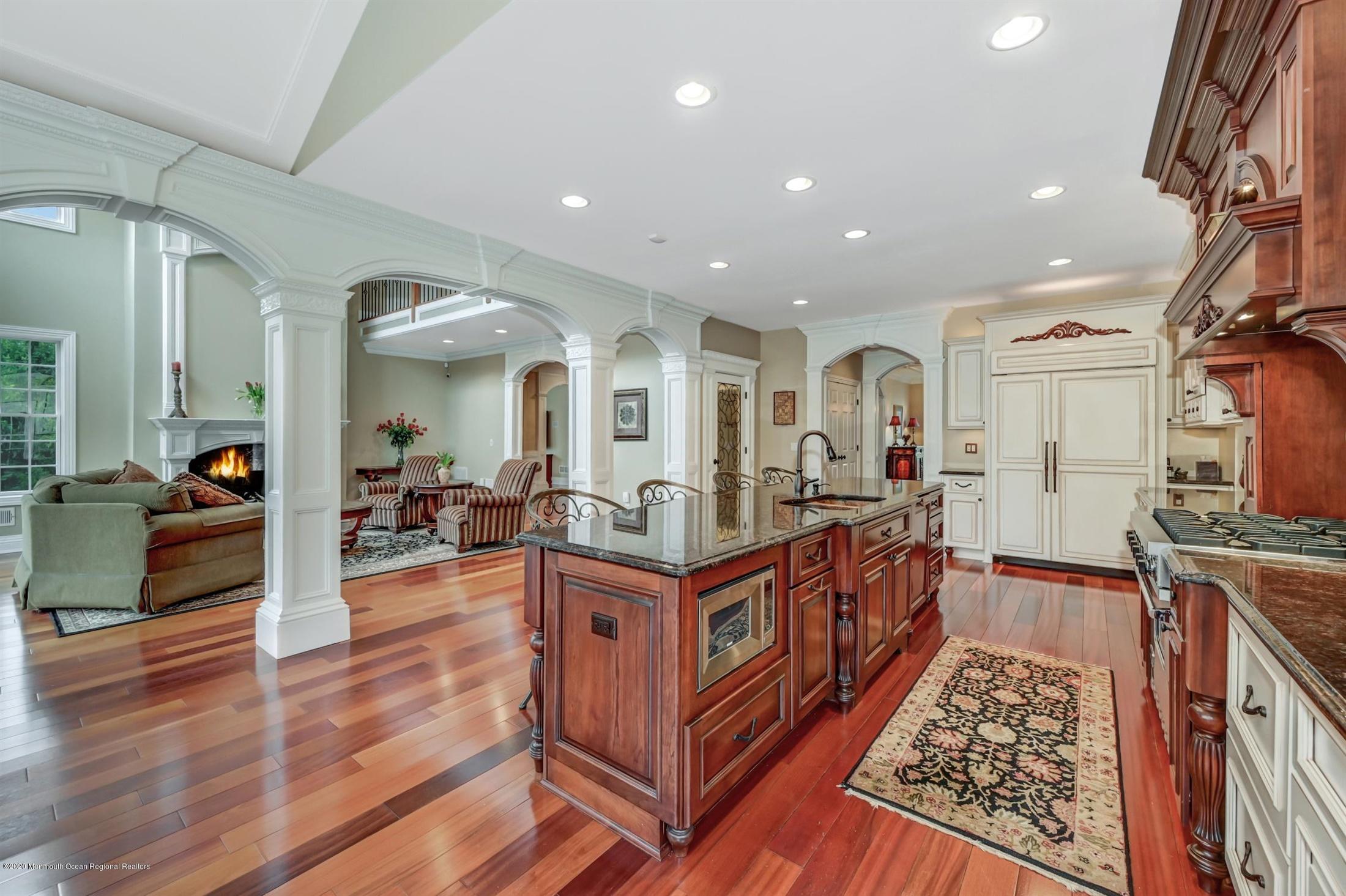 8 Maple Leaf Drive Holmdel, NJ 07733 - Photo 24 of 74 a very nice looking living room with wooden floor and furniture