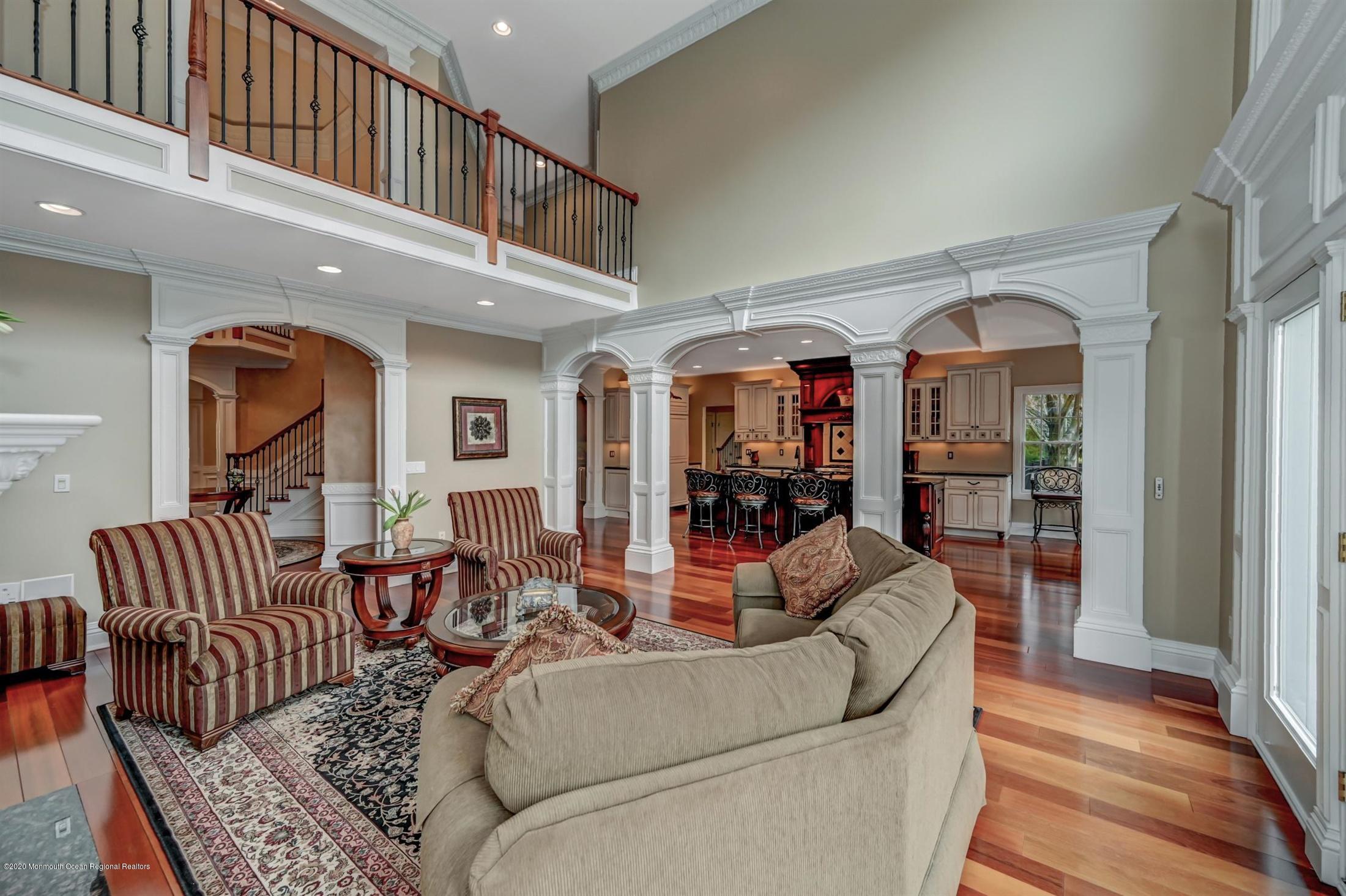 8 Maple Leaf Drive Holmdel, NJ 07733 - Photo 26 of 74 a living room with furniture ceiling fan and a rug