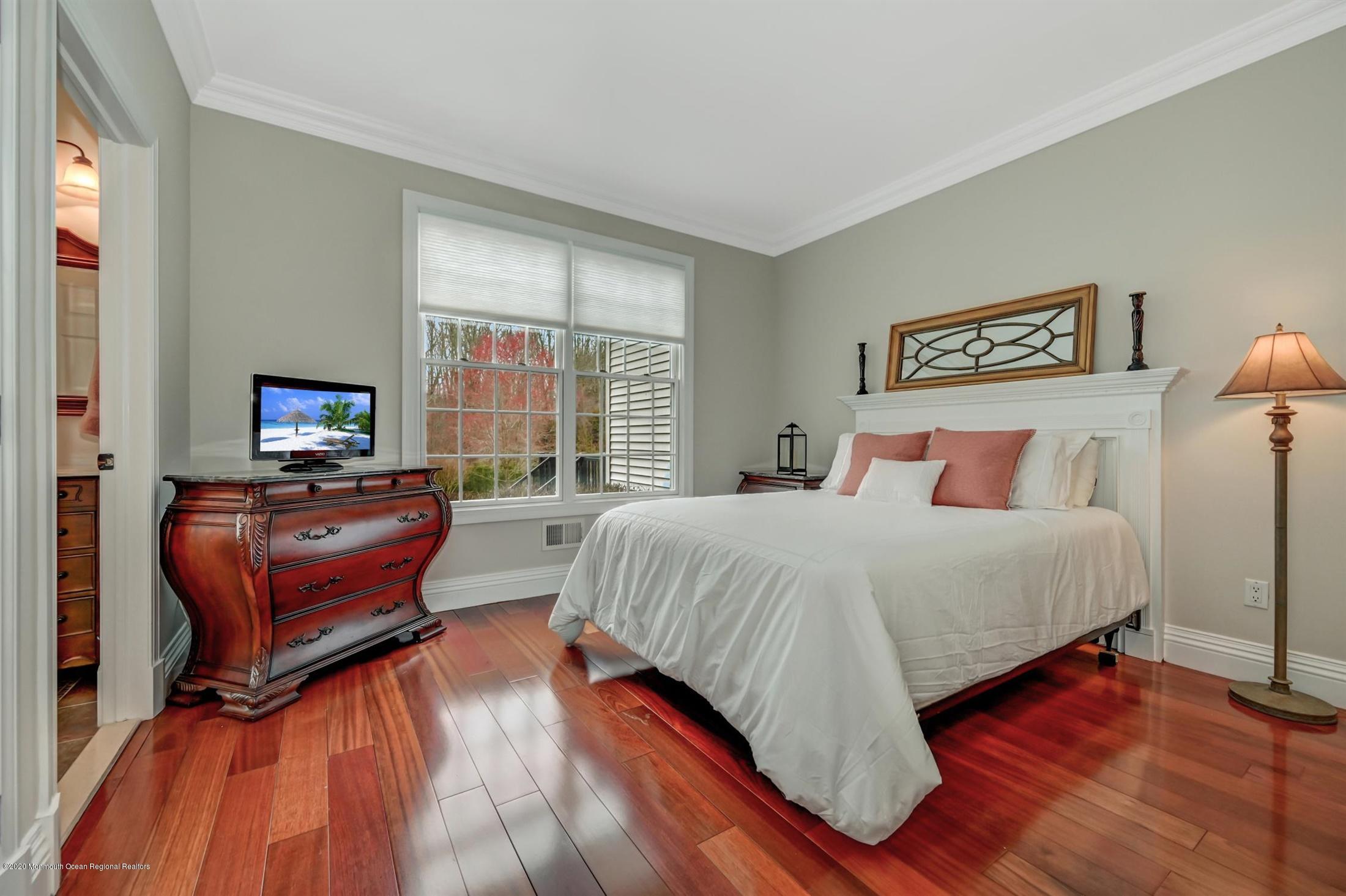 8 Maple Leaf Drive Holmdel, NJ 07733 - Photo 31 of 74 a bedroom with furniture and a flat screen tv