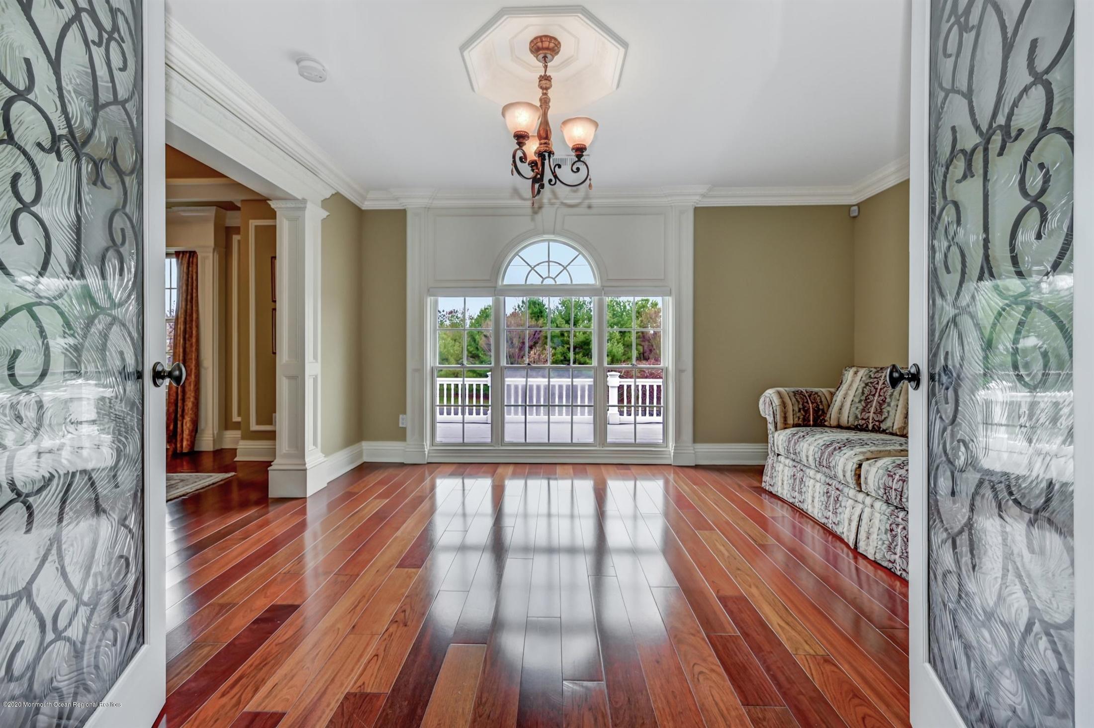 8 Maple Leaf Drive Holmdel, NJ 07733 - Photo 35 of 74 a view of a livingroom with wooden floor and a chandelier