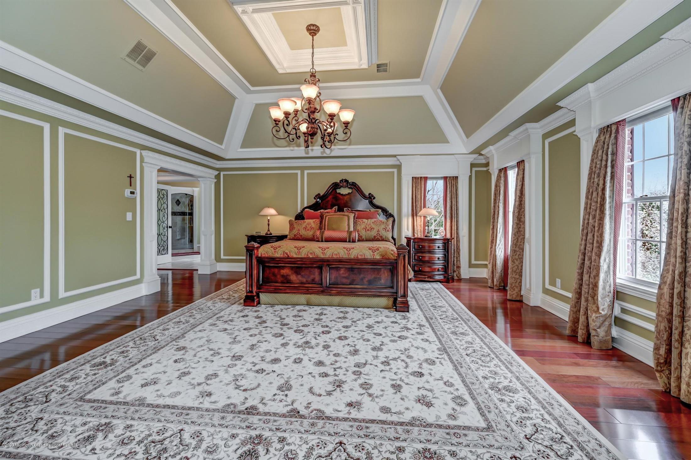 8 Maple Leaf Drive Holmdel, NJ 07733 - Photo 36 of 74 a living room with furniture and a chandelier