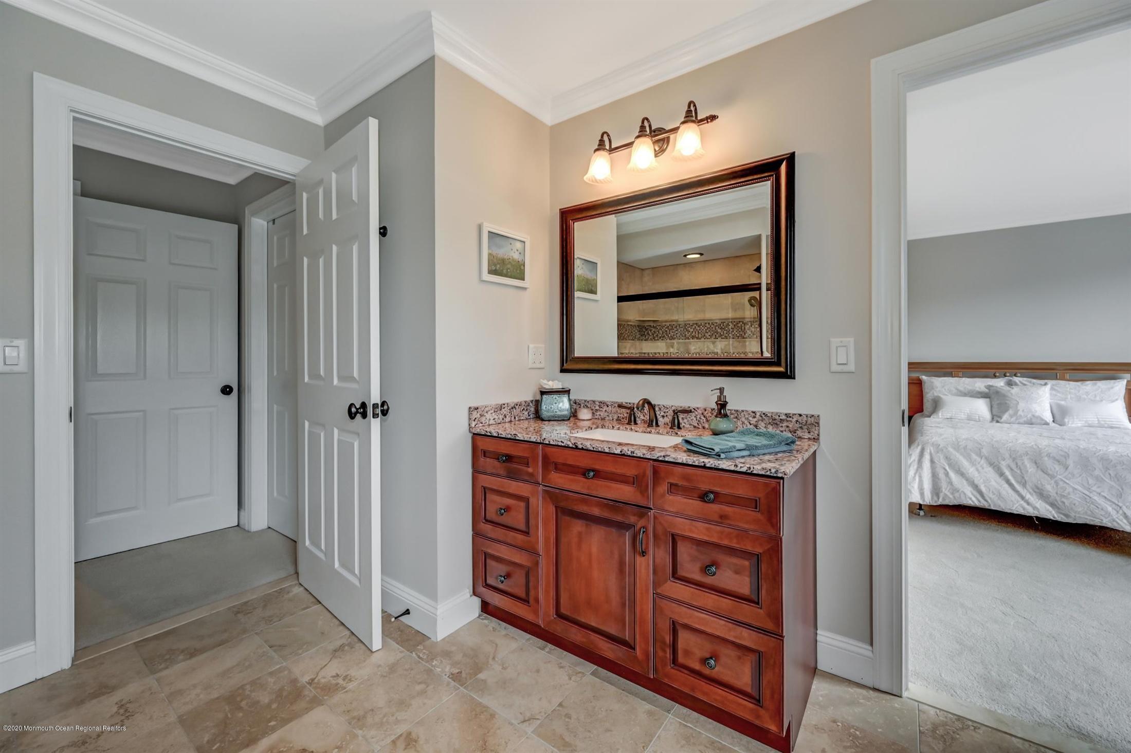 8 Maple Leaf Drive Holmdel, NJ 07733 - Photo 46 of 74 a bathroom with a toilet sink and mirror