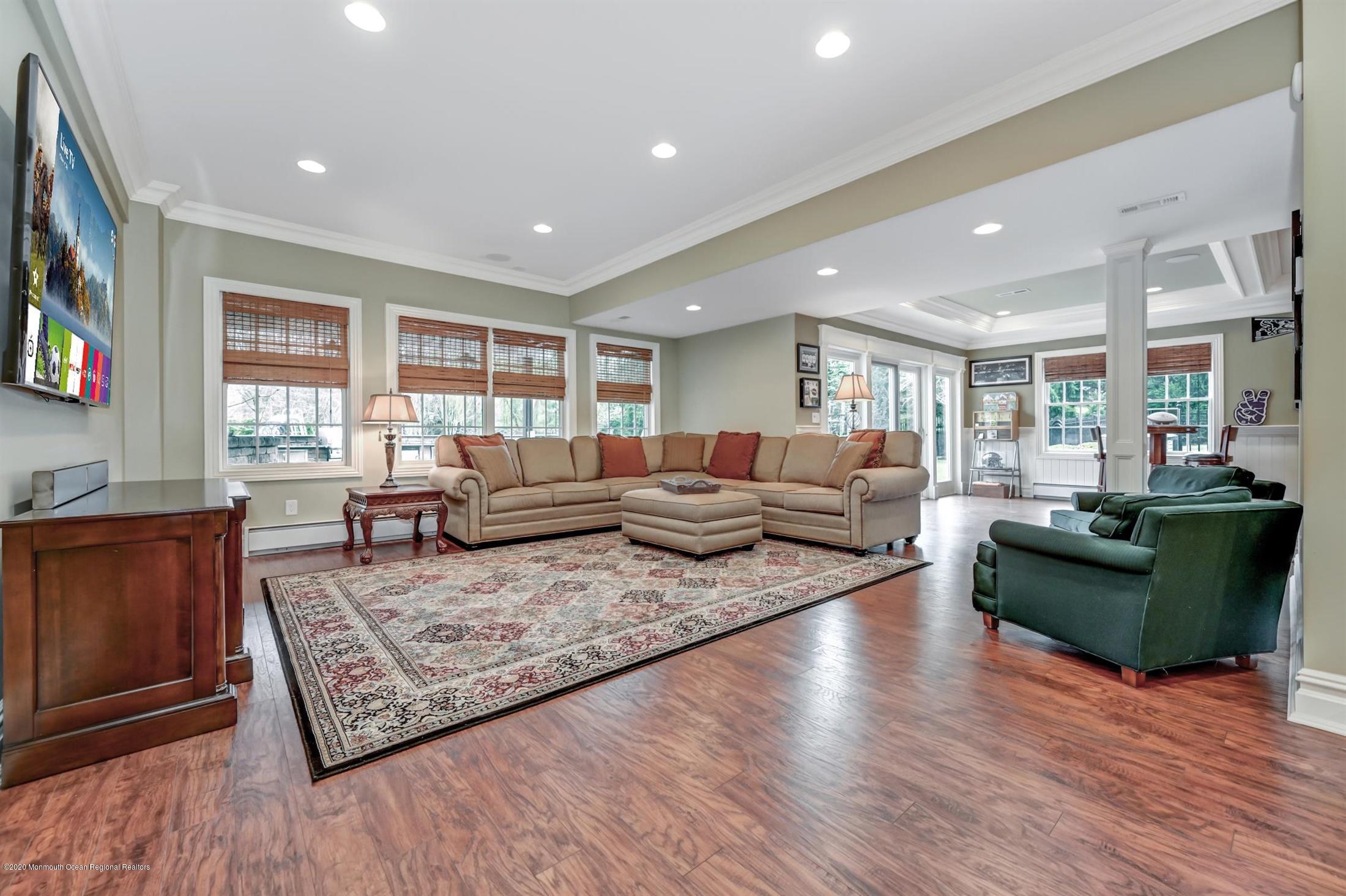 8 Maple Leaf Drive Holmdel, NJ 07733 - Photo 51 of 74 a living room with furniture and a flat screen tv