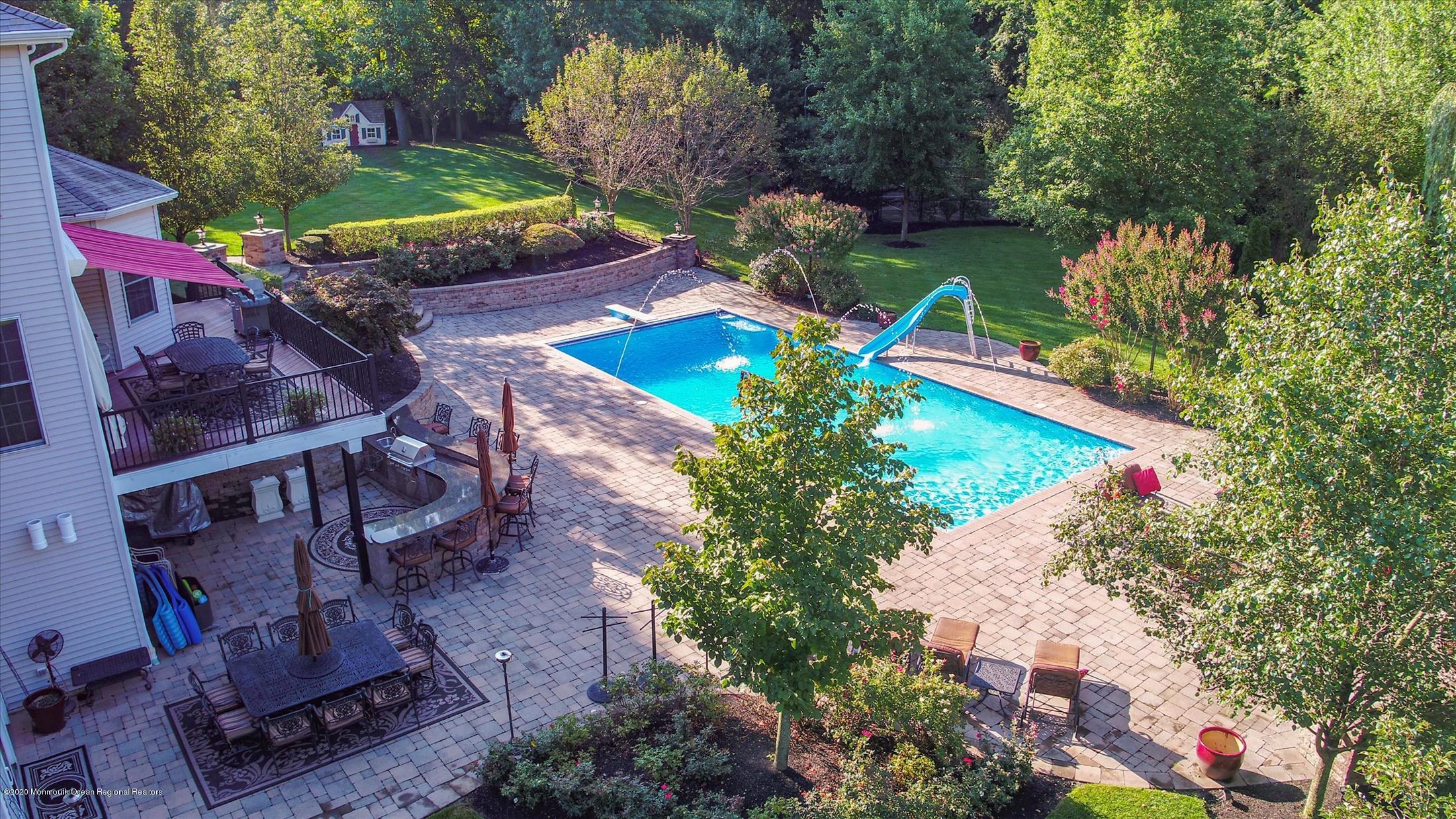 8 Maple Leaf Drive Holmdel, NJ 07733 - Photo 60 of 74 a view of a backyard with sitting area