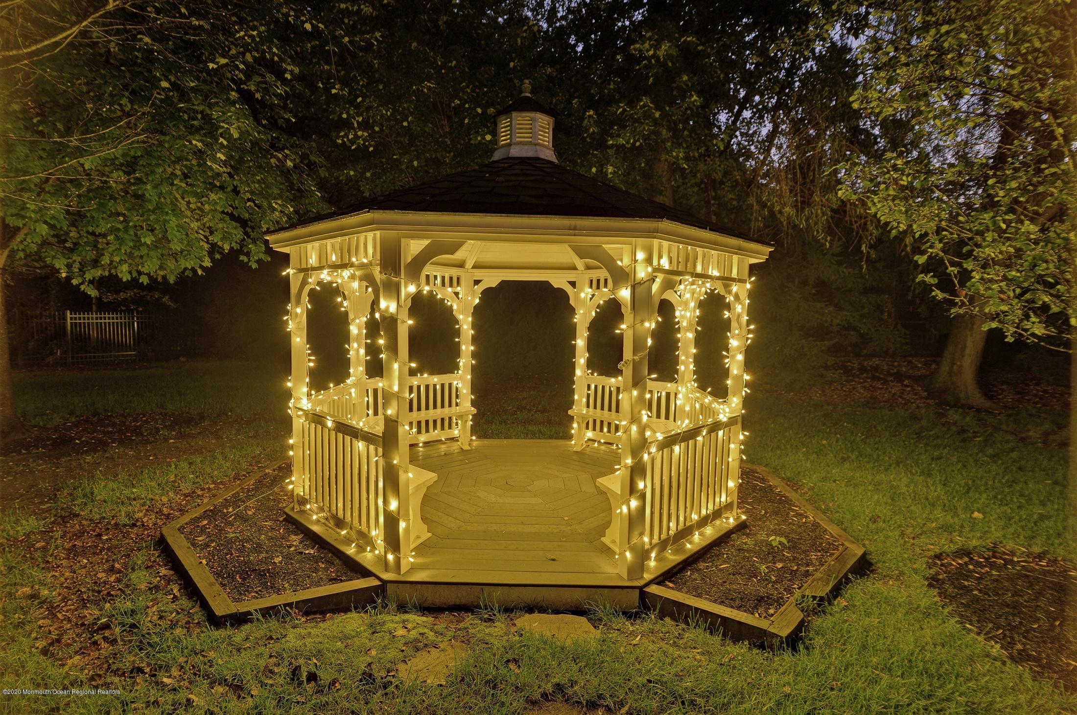 8 Maple Leaf Drive Holmdel, NJ 07733 - Photo 66 of 74 a front view of a house with a yard