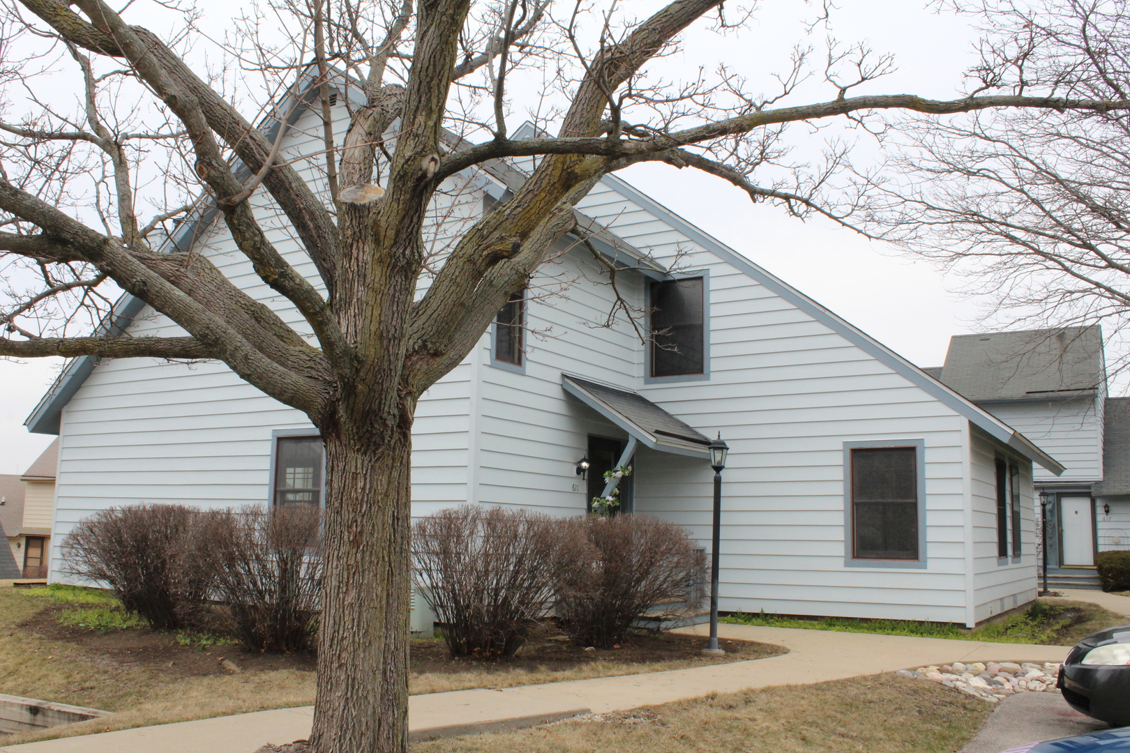 611 Dunham Road Gurnee, IL 60031 - Photo 1 of 15 a front view of a house with a tree