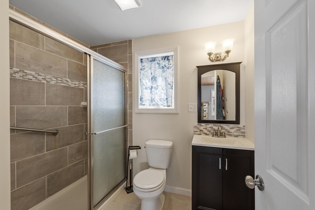 4 Ridge Road Pepperell, MA 01463 - Photo 34 of 42 a bathroom with a toilet a sink and mirror
