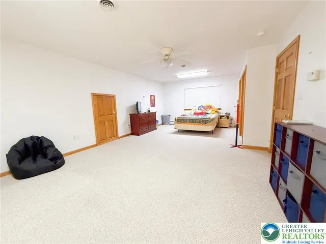 a car parked in front of white house