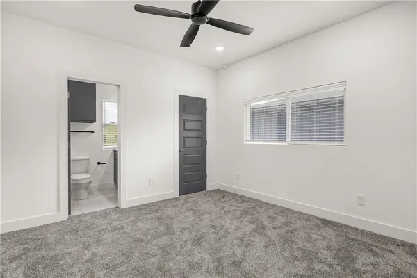 a view of an empty room with a bathroom