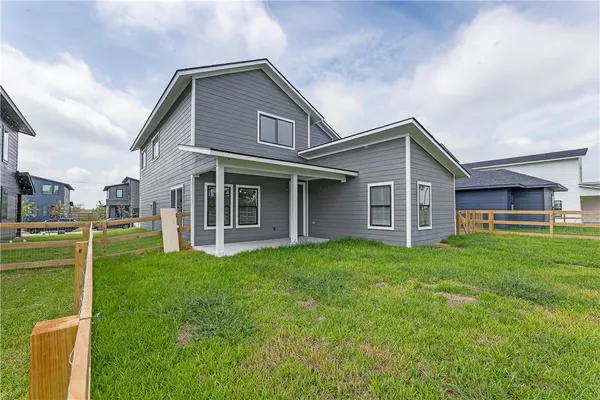 a view of a yard in front of a house