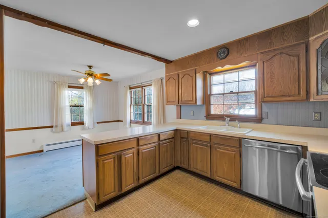 a kitchen with sink cabinets and window