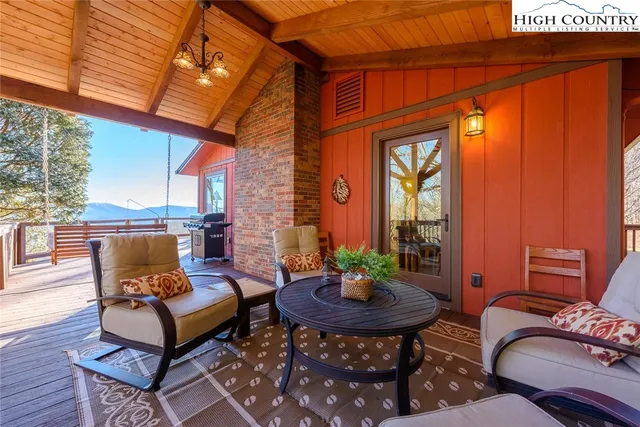 a outdoor living space with furniture and a fireplace