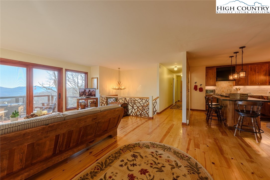 1776 Beech Mountain Parkway Beech Mountain, NC 28604 - Photo 13 of 34 a living room with furniture and a large window