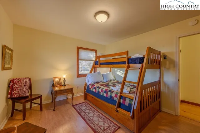 a bedroom with furniture and a lamp