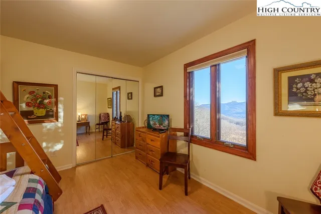 a view of a livingroom with furniture and workspace