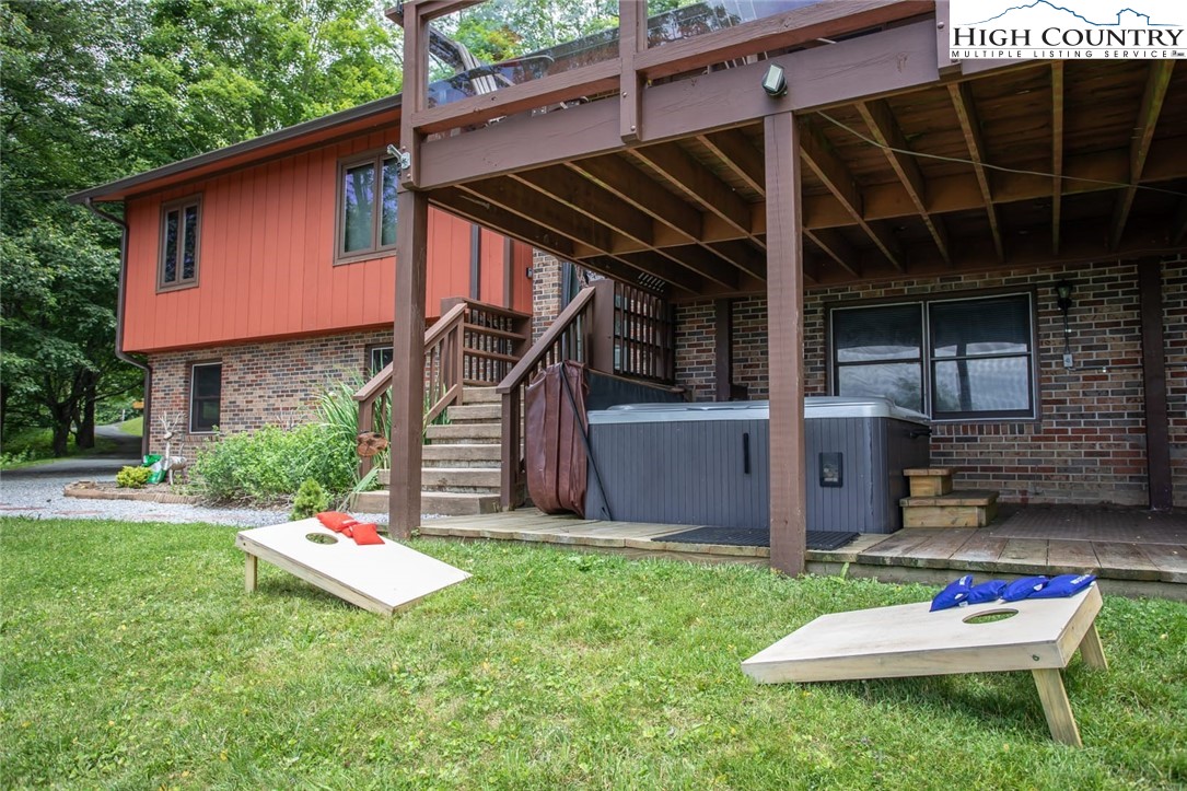 1776 Beech Mountain Parkway Beech Mountain, NC 28604 - Photo 29 of 34 a house with a garden in front of it