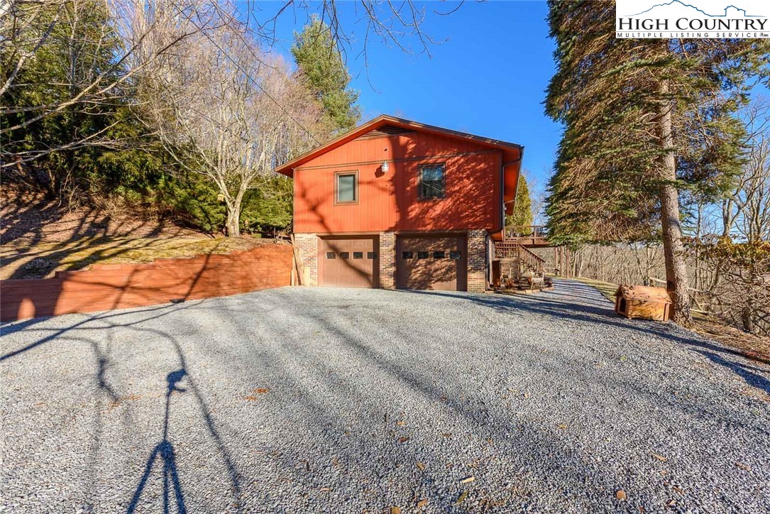 1776 Beech Mountain Parkway Beech Mountain, NC 28604 - Photo 31 of 34 a view of a bench in a yard