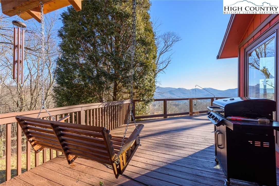 1776 Beech Mountain Parkway Beech Mountain, NC 28604 - Photo 5 of 34 a view of a roof deck with wooden floor and fence