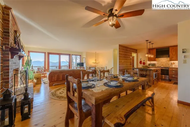 a living room with lots of furniture and a large window