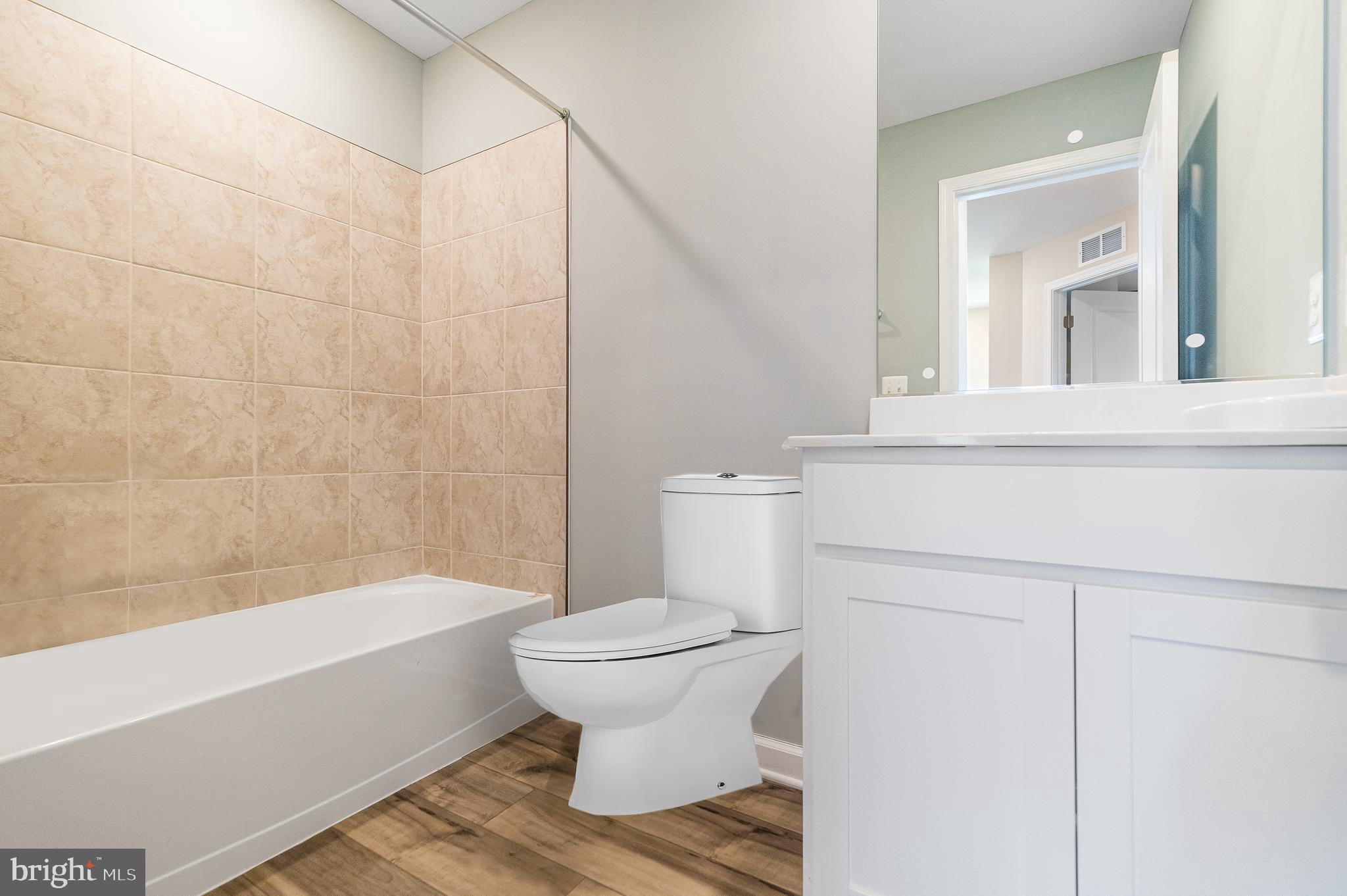 410 18th Avenue Ranson, WV 25438 - Photo 16 of 26 a bathroom with a toilet and a bathtub