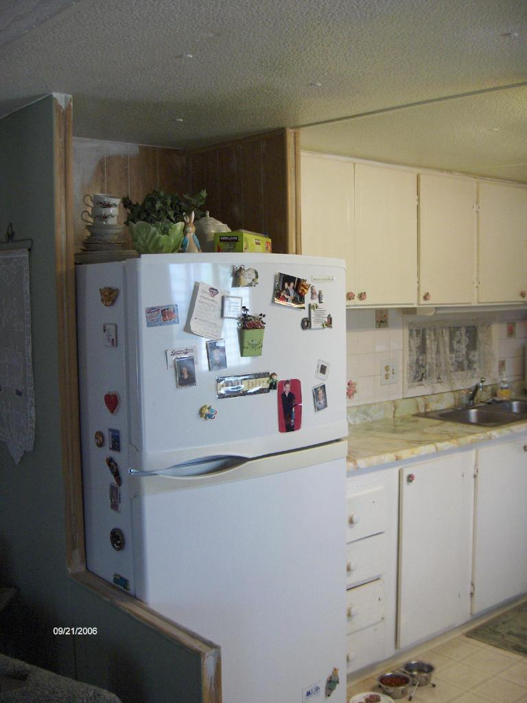 17990 Oasis Road Redding, CA 96003 - Photo 5 of 7 a kitchen with refrigerator and cabinets