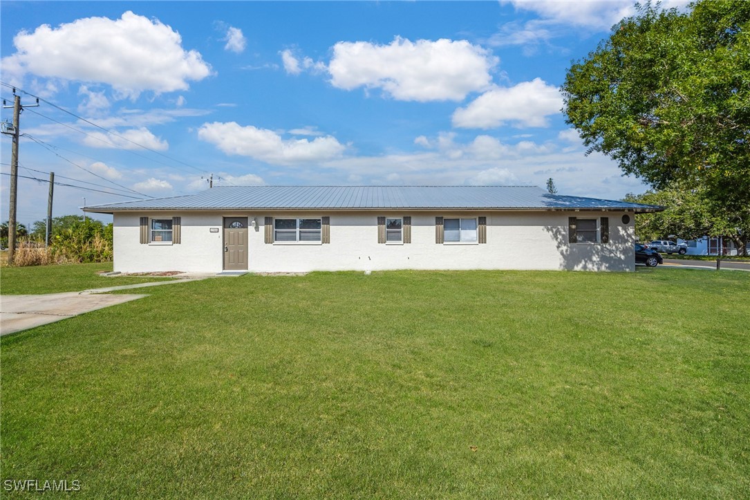 12955 First Street Fort Myers, FL 33905 - Photo 1 of 48 a front view of a house with garden