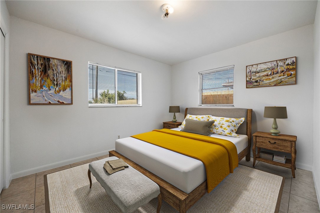 12955 First Street Fort Myers, FL 33905 - Photo 17 of 48 a bedroom with a bed and wooden floor