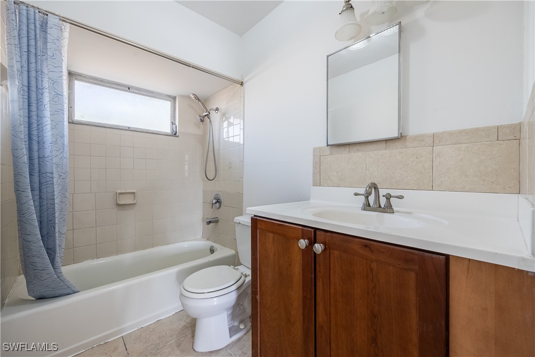 12955 First Street Fort Myers, FL 33905 - Photo 18 of 48 a bathroom with a granite countertop sink toilet and shower