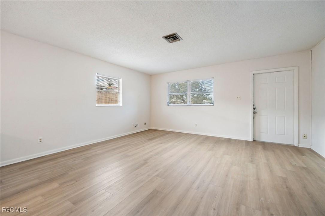 12955 First Street Fort Myers, FL 33905 - Photo 24 of 48 a view of a room that has wooden floor and white walls